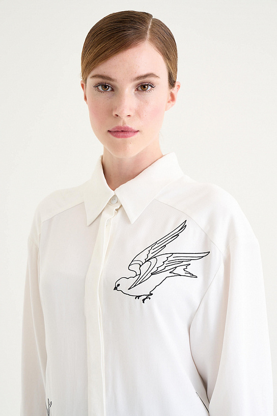 Women's white blouse made of cotton with embroidery