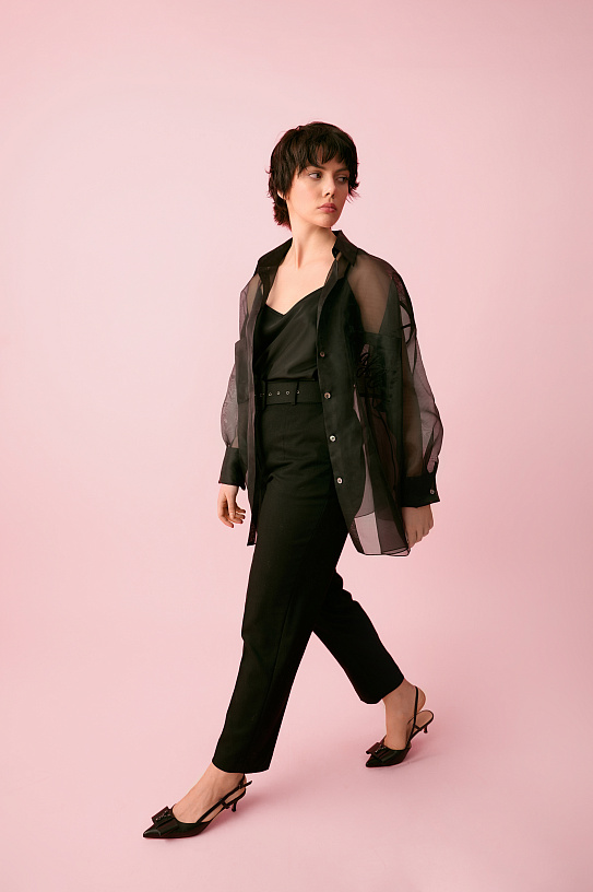 Trousers are black, narrowed