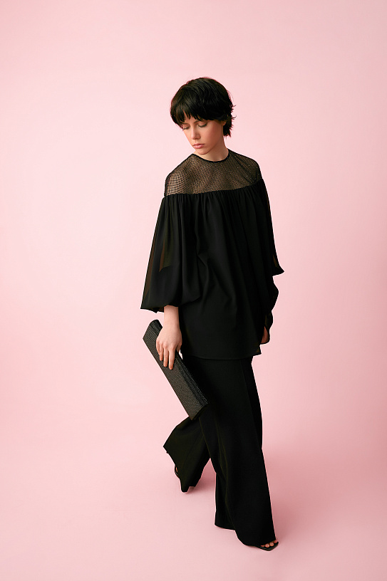 Blouse is black